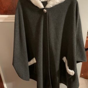 NWOT. Cape/Poncho with hood made by LeModa. Very stylish. Never worn. One size.